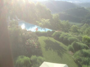 Readying the pool - early morning at Bellaugello Gay Guest House in Umbria, Italy